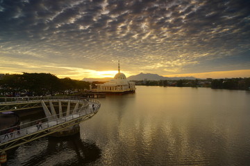 wonderful sunset with islamic mosque and bridge at kuching sarawak