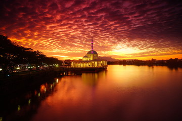 wonderful sunset with islamic mosque and bridge at kuching sarawak