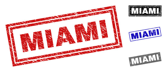 Grunge MIAMI rectangle stamp seals isolated on a white background. Rectangular seals with grunge texture in red, blue, black and grey colors.