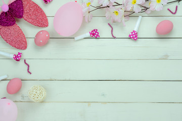 Table top view shot of decoration Happy Easter holiday background concept.Flat lay variety bunny eggs with pink flower and decor for festive season on modern rustic white plank wood.copy space design.
