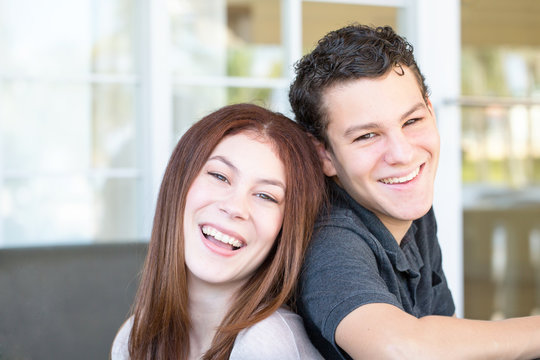 Portrait Of A Brother And Sister Smiling.