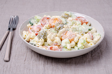 Salad with pasta and raw vegetables