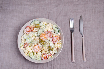 Salad with pasta and raw vegetables