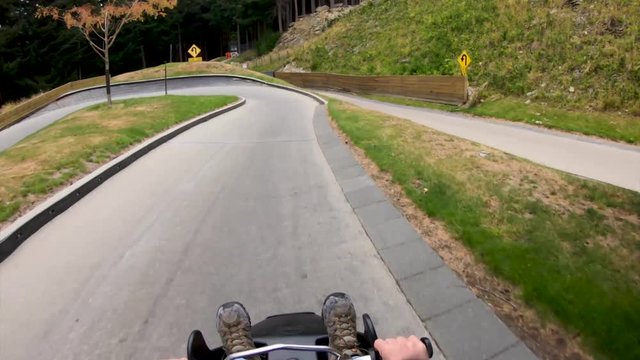 Ride a luge down the mountain in Queenstown New Zealand