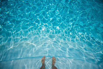 Male Feet Underwater in Swimming Pool