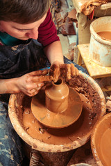 Potter at work. Workshop place.
