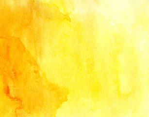 Abstract background. The texture of the paper, tinted with light and deep stains of yellow watercolor.