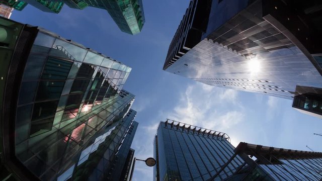Timelapse of Fisheye view of offices at at midday with the sun passing overhead city life cityscape office