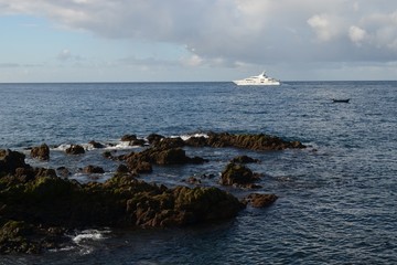 Yacht near the shores the island of Madeira