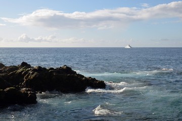 Yacht near the shores the island of Madeira