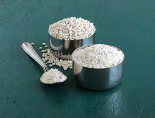 Barley flour, which is an ingredient in food items like bread and muffins, and pearl barley in a...
