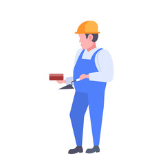 man builder holding trowel and wall brick guy wearing uniform and helmet construction worker professional occupation concept male cartoon character full length flat isolated