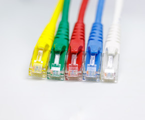 Close up multi coloured ethernet network cables  isolate on white background,Bunch of multi colored RJ45 cables,Spot focus.