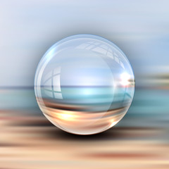 Realistic 3D sphere on the background of the beach and the sea