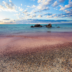 Elafonissi, famous greek beach on Crete. Sky clouds, blue sea and pink sand in Greece
