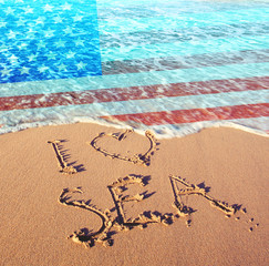 Beach sand, sea and flag USA. I love USA concept