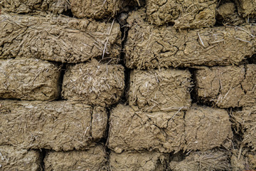 The brick from clay and straw, is laid out on all background