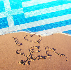 Beach sand, sea and flag Greece. I love Greece concept