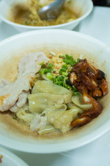 Egg noodle topping with red BBQ pork with soup