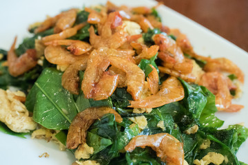 Stir-Fried Melinjo Leaves with Eggs topped with dried shrimps Thai Southern traditional food style