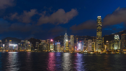 Fototapeta premium Cityscape and skyline at Victoria Harbour at sunset time. Popular view point of Hong Kong city at twilight time