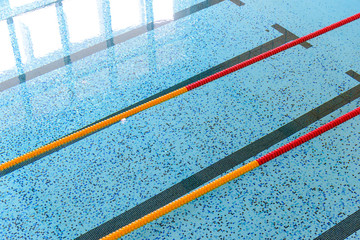 Top view of indoor swimming pool with race tracks or lane marke