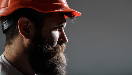 Bearded man worker with beard in building helmet or hard hat. Man builders, industry. Portrait...