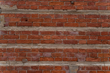 background texture of old red brick walls. Wallpaper or desktop design