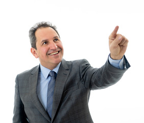 Portrait of a middle aged confident businessman pointing at copy space. Isolated on white.