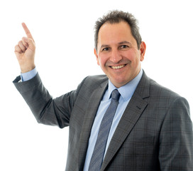 Portrait of a middle aged confident businessman pointing at copy space. Isolated on white.