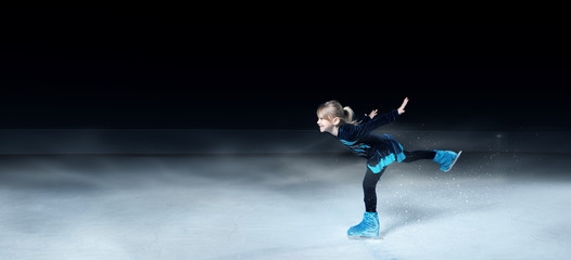 view of child  figure skater on dark ice arena background © Dmitry Vavilon 