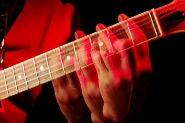 The dynamics of playing the guitar. Guitarist fingers spread all over the fretboard. Repeated...