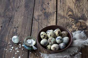 Boiled quail eggs on a wooden table