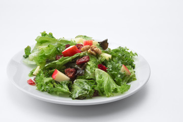 close up view of fresh vegetable salad on white background
