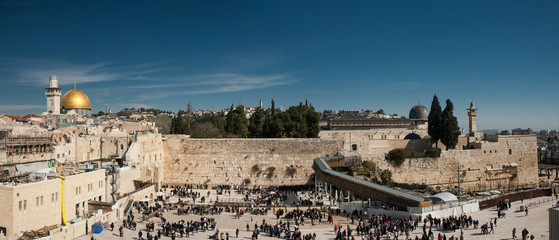 Fototapeta premium Wall of Tears. Panoramic view onto Western Wall of Jerusalem Temple and the dome of mosque Al Aqsa. The center of world's spiritual culture and the root of all modern cultural and political conflicts