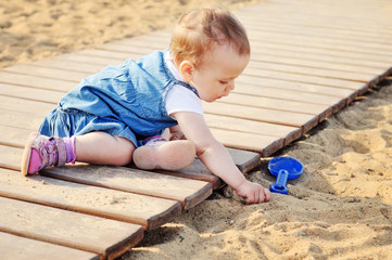 girl playing sand