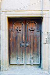 Facades of old rusty doors. Beautiful arches with greenery in the fortresses.