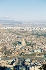 Sunset and evening city Tbilisi, Georgia. Panoramic views and lights of historic neighborhoods.