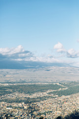 Sunset and evening city Tbilisi, Georgia. Panoramic views and lights of historic neighborhoods.