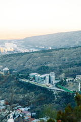 Sunset and evening city Tbilisi, Georgia. Panoramic views and lights of historic neighborhoods.
