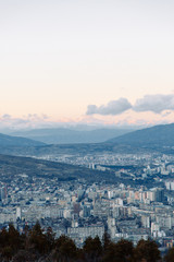Obraz premium Sunset and evening city Tbilisi, Georgia. Panoramic views and lights of historic neighborhoods.