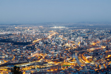 Sunset and evening city Tbilisi, Georgia. Panoramic views and lights of historic neighborhoods.