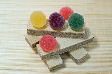 Classic waffles with butter and strawberry marmalade.