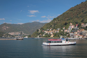 Pleasure craft on lake in mountains. Como, Italy