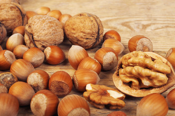 Walnuts and hazelnuts on a wooden table