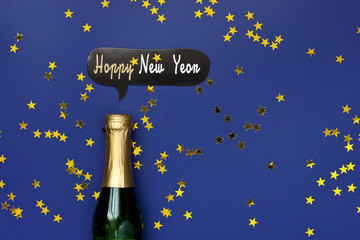  Champagne bottle with colorful party confetti