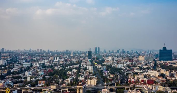 Aerial hyperlapse of Mexico City at day in the San Antonio freeway