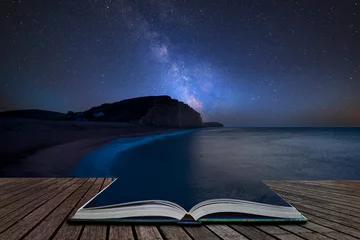 Foto op Plexiglas Levendige composietafbeelding van de Melkweg over landschap van lange blootstelling van West Bay in Dorset die uit pagina& 39 s komt in een magisch verhalenboek © veneratio
