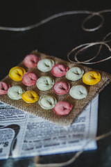 Ravioli of red, yellow and green color on eco rustic fabric