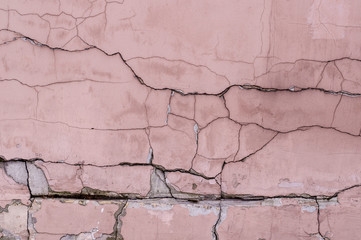 painted weathered cracked textured pink wall. background, exterior